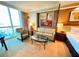 Relaxing living room area with large windows, comfortable seating, and a modern aesthetic at 125 E Harmon Ave # 2718, Las Vegas, NV 89109