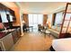 Comfortable living space with kitchenette, dining area, and seating offering spectacular views from the expansive windows at 125 E Harmon Ave # 2718, Las Vegas, NV 89109