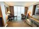Inviting living space featuring a dining table, comfortable seating, and expansive windows with breathtaking city views at 125 E Harmon Ave # 2718, Las Vegas, NV 89109