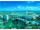 Breathtaking view showcasing the Topgolf driving range set against the backdrop of the city skyline and distant mountains at 125 E Harmon Ave # 2718, Las Vegas, NV 89109