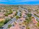 This home boasts solar panels, a balcony, and attractive landscaping in a desirable neighborhood at 1367 Minuet St, Henderson, NV 89052