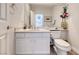 View of a half-bath with a white vanity and tile floor at 1367 Minuet St, Henderson, NV 89052
