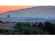 City skyline view with the sunset over distant mountains at 1367 Minuet St, Henderson, NV 89052