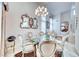 Charming dining area featuring a glass table, comfortable seating, and a decorative chandelier at 1367 Minuet St, Henderson, NV 89052