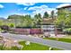 The Anthem by Del Webb entrance has a beautiful waterfall feature and lush landscaping in a desert landscape at 1367 Minuet St, Henderson, NV 89052