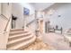 Elegant foyer with high ceilings, grand staircase, marble floors, and decorative chandelier at 1367 Minuet St, Henderson, NV 89052