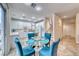 Spacious eat-in kitchen featuring a glass table, marble flooring and seamless access to the main staircase at 1367 Minuet St, Henderson, NV 89052