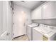 Functional laundry room with washer, dryer, and cabinetry at 1367 Minuet St, Henderson, NV 89052