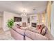 Bright living room showcasing a chandelier, fireplace, and comfortable seating at 1367 Minuet St, Henderson, NV 89052