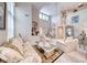 Bright living room with high ceilings, chandelier, and stylish furniture, perfect for entertaining at 1367 Minuet St, Henderson, NV 89052