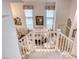 Upstairs view of the formal living area with chandelier and natural lighting at 1367 Minuet St, Henderson, NV 89052