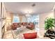 Inviting living room with fireplace, stylish decor, and an open view of the kitchen at 1367 Minuet St, Henderson, NV 89052