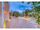 Spacious outdoor patio with seating area surrounded by desert foliage and mature palm trees at 1367 Minuet St, Henderson, NV 89052