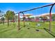 A neighborhood playground featuring swings, slides, and a shade structure, perfect for Gathering fun at 1367 Minuet St, Henderson, NV 89052