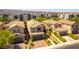 Aerial view showcasing community homes featuring tile roofs, two-car garages, and desert landscaping at 1433 Overseer Ave, Henderson, NV 89074