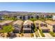 Aerial view of modern homes with desert landscaping, garages, and tile roofs at 1433 Overseer Ave, Henderson, NV 89074