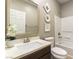 Bathroom featuring a vanity, a tub, and a shower, all next to the toilet at 1433 Overseer Ave, Henderson, NV 89074