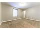 Neutral bedroom featuring carpet, baseboards, and a window with white shutters at 1433 Overseer Ave, Henderson, NV 89074