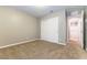 Bedroom featuring plush carpeting, fresh walls, and a closet with sliding doors for ample storage at 1433 Overseer Ave, Henderson, NV 89074