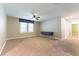 Large bedroom with neutral carpet, ceiling fan, and multiple windows offering plenty of natural light at 1433 Overseer Ave, Henderson, NV 89074