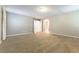 Spacious bedroom featuring neutral walls, plush carpet, and ample natural light from windows at 1433 Overseer Ave, Henderson, NV 89074