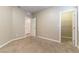 Neutral bedroom featuring plush carpeting, fresh walls, and an adjacent walk-in closet for ample storage at 1433 Overseer Ave, Henderson, NV 89074