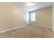 Bright bedroom featuring plush carpeting, fresh walls, and a window at 1433 Overseer Ave, Henderson, NV 89074