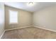 Bright bedroom with a large window, fresh paint, and plush carpeting at 1433 Overseer Ave, Henderson, NV 89074
