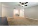 Spacious bedroom with plush carpeting and a ceiling fan, offering a comfortable retreat at 1433 Overseer Ave, Henderson, NV 89074