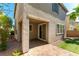Back patio featuring hardscape pavers, stucco columns, and backyard access at 1433 Overseer Ave, Henderson, NV 89074