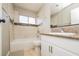 Bathroom featuring a shower and tub combo, granite countertop, and tiled shower at 1509 Lucilee St, Las Vegas, NV 89101