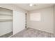 Comfortable bedroom with neutral carpet, ceiling fan, and closet with sliding doors at 1509 Lucilee St, Las Vegas, NV 89101