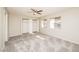 Bright bedroom with plush carpeting, ceiling fan, and ample closet space at 1509 Lucilee St, Las Vegas, NV 89101