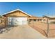 Single-story home featuring a driveway, garage and fenced yard at 1509 Lucilee St, Las Vegas, NV 89101