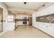 Updated kitchen with stainless steel appliances and white cabinetry at 1509 Lucilee St, Las Vegas, NV 89101