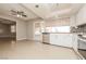 Bright kitchen with white cabinets, modern appliances, and access to the backyard at 1509 Lucilee St, Las Vegas, NV 89101