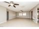 Spacious living room featuring neutral paint, tile floors, and ceiling fans at 1509 Lucilee St, Las Vegas, NV 89101