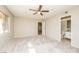 Inviting primary bedroom with large window, ceiling fan, and attached bathroom at 1509 Lucilee St, Las Vegas, NV 89101