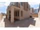 View of the backyard with a covered patio, and neutral-colored siding at 1799 Passerine St, Las Vegas, NV 89138