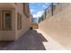 Backyard displaying partial fence and neutral-colored siding and brick features at 1799 Passerine St, Las Vegas, NV 89138
