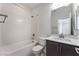 Bathroom features a bathtub, toilet, and vanity with modern fixtures at 1799 Passerine St, Las Vegas, NV 89138