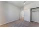 Bedroom featuring carpeted flooring, sliding closet doors and natural light at 1799 Passerine St, Las Vegas, NV 89138