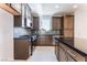 Modern kitchen featuring dark cabinets, stainless steel appliances, and sleek countertops at 1799 Passerine St, Las Vegas, NV 89138