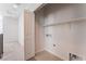 Laundry room featuring tile flooring, shelving, washer and dryer hookups at 1799 Passerine St, Las Vegas, NV 89138