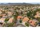 A scenic aerial view captures a lovely home with a pool, palm trees, and well-maintained surroundings at 1990 Freeman Ct, Henderson, NV 89014