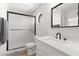 Bathroom featuring shower with a glass door, modern vanity and tile floors at 1990 Freeman Ct, Henderson, NV 89014
