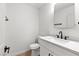 Bright bathroom featuring a sleek vanity with marble top and black fixtures at 1990 Freeman Ct, Henderson, NV 89014