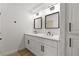Bathroom featuring double vanity with modern fixtures, mirrors, and lighting at 1990 Freeman Ct, Henderson, NV 89014