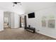 Spacious bedroom featuring a ceiling fan, large windows, and access to the backyard at 1990 Freeman Ct, Henderson, NV 89014