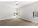 Bedroom with large windows providing natural light and plush carpeting at 1990 Freeman Ct, Henderson, NV 89014